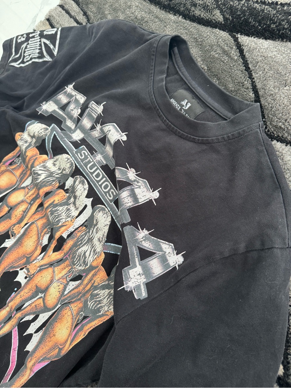 Essentials Black Short Sleeve Graphic Tee with Orange & White Print